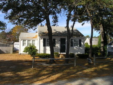 41 Longell Road Dennis Port, MA 02639 - Photo 1 of 14 front view of a house with a tree