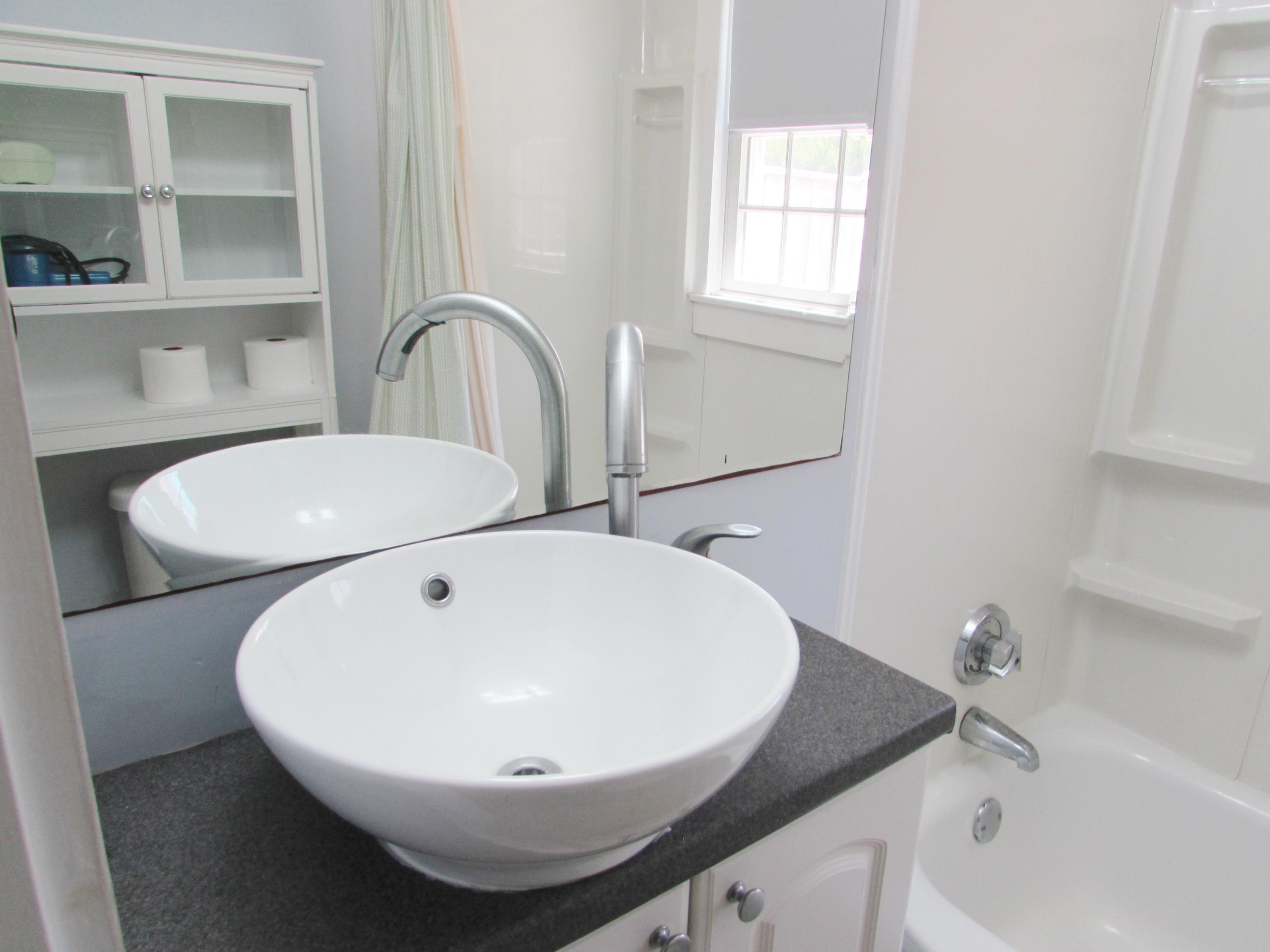 41 Longell Road Dennis Port, MA 02639 - Photo 13 of 14 a bathroom with a sink and a mirror