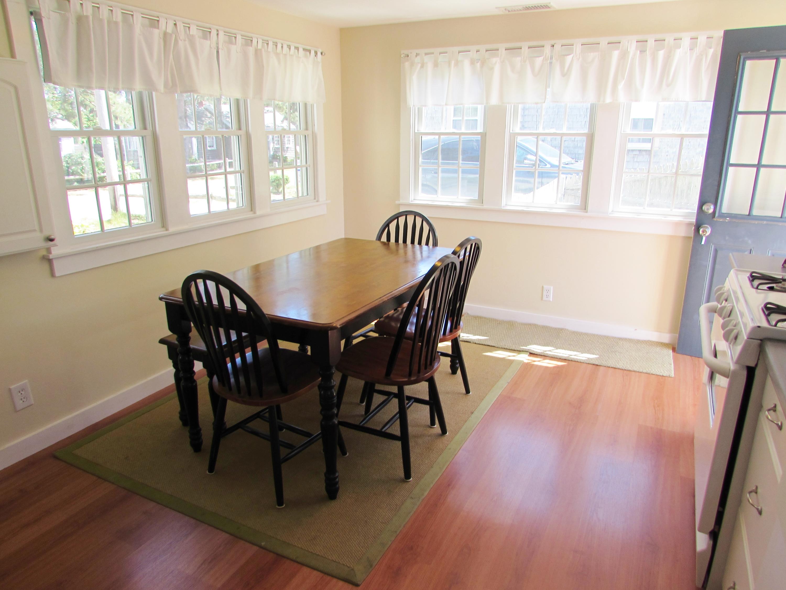 41 Longell Road Dennis Port, MA 02639 - Photo 2 of 14 a view of a dining room with furniture and wooden floor