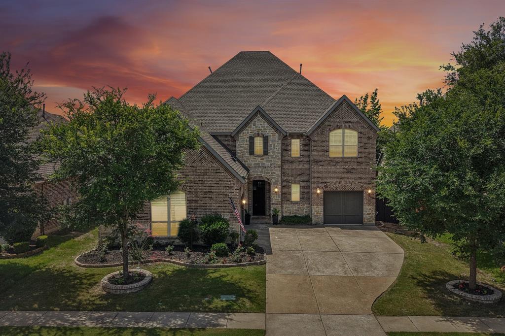 2029 Temperate Drive Allen, TX 75013 - Photo 32 of 40 a front view of a house with garden