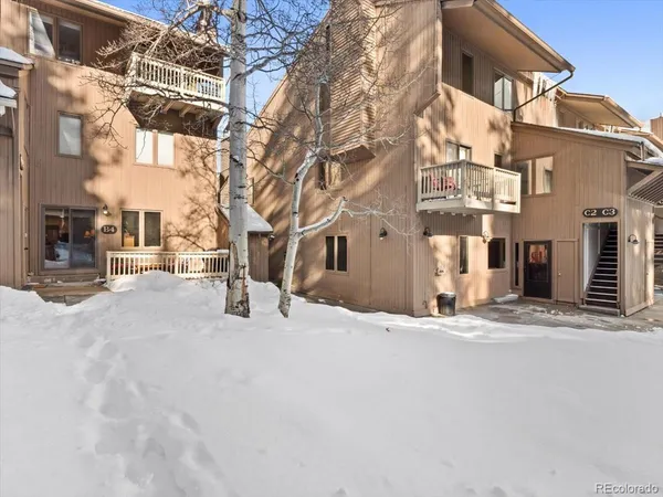 a view of a building with a snow on the road