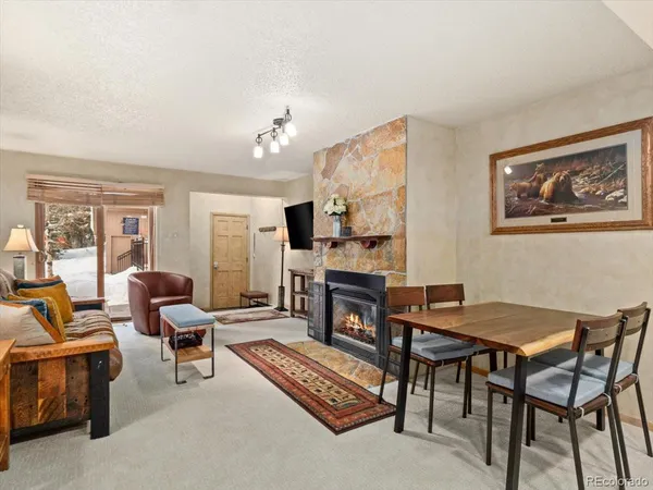 a view of a livingroom with furniture and a table