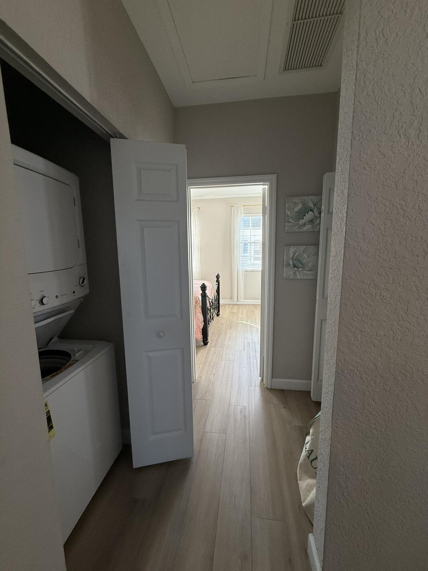 110 Sea Plum Drive, Unit 103 Jupiter, FL 33458 - Photo 17 of 31 a view of hallway with wooden floor and furniture