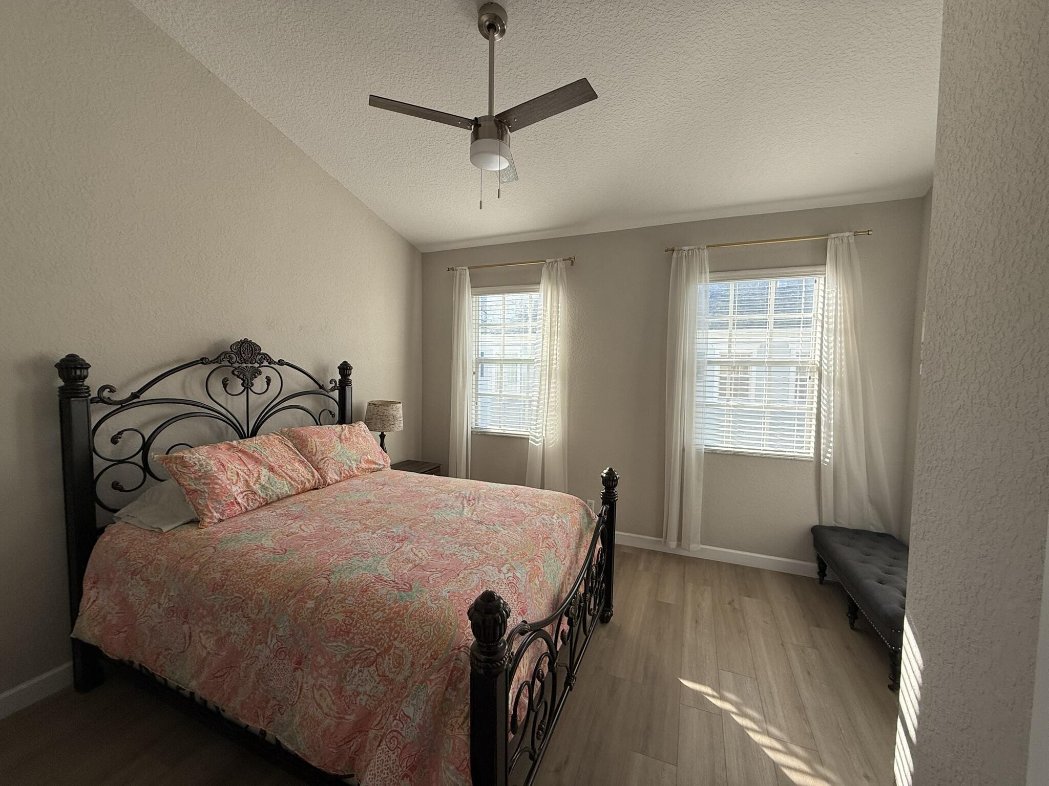 110 Sea Plum Drive, Unit 103 Jupiter, FL 33458 - Photo 18 of 31 a bedroom with a bed and window