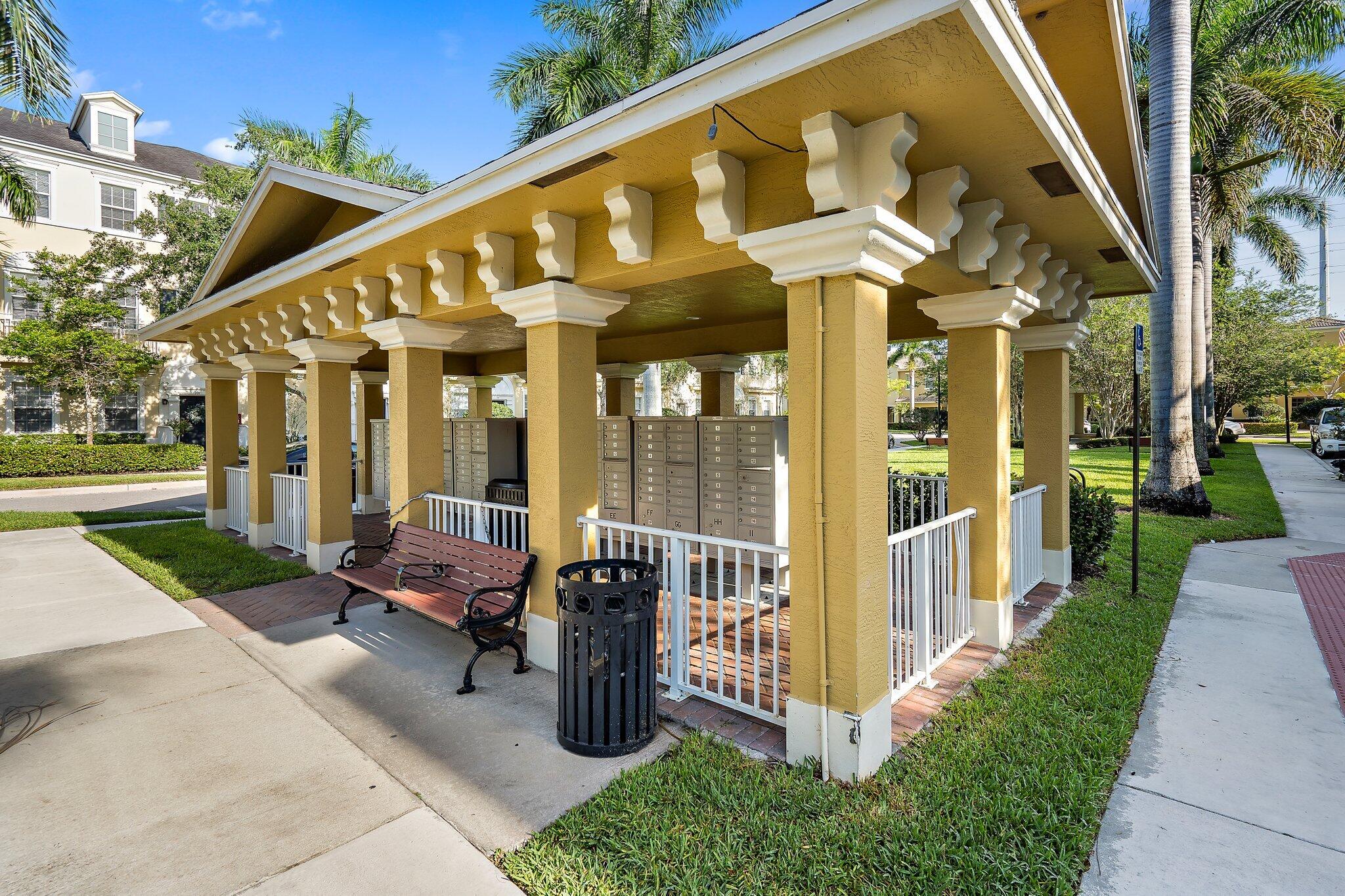 110 Sea Plum Drive, Unit 103 Jupiter, FL 33458 - Photo 24 of 31 a view of a building with sitting area and garden