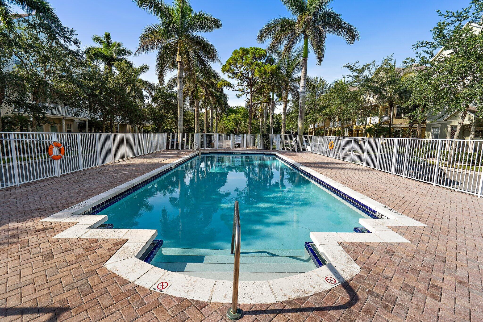 110 Sea Plum Drive, Unit 103 Jupiter, FL 33458 - Photo 7 of 31 a view of a backyard with swimming pool