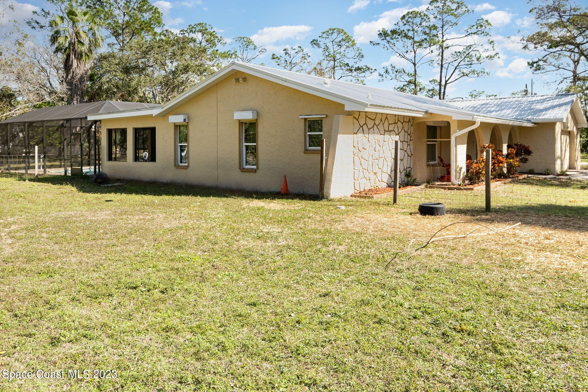 2160 Valkaria Road Malabar, FL 32950 - Photo 12 of 36 Side Home