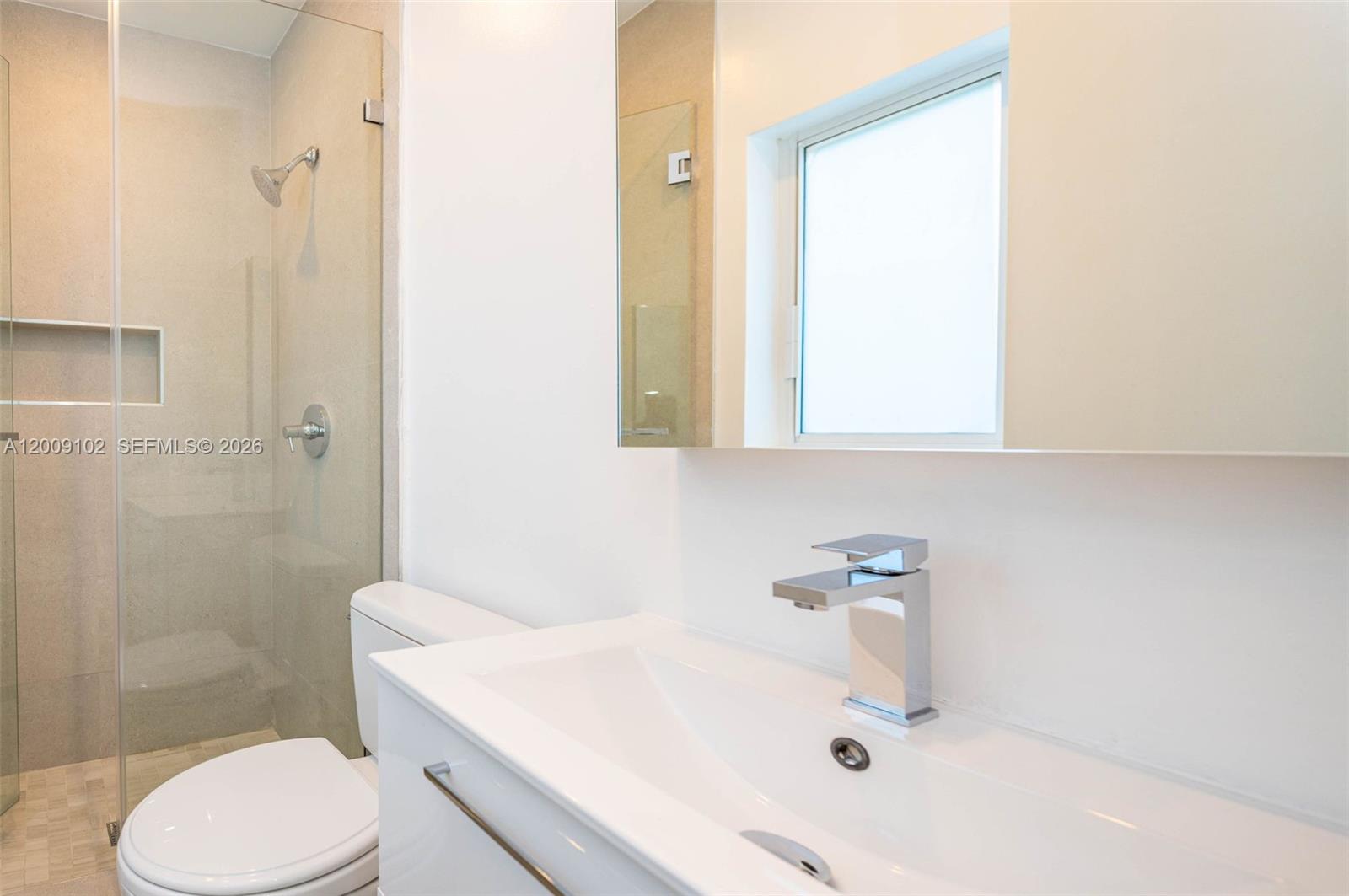 330 Southwest 27th Road Miami, FL 33129 - Photo 19 of 62 a bathroom with a sink toilet and shower