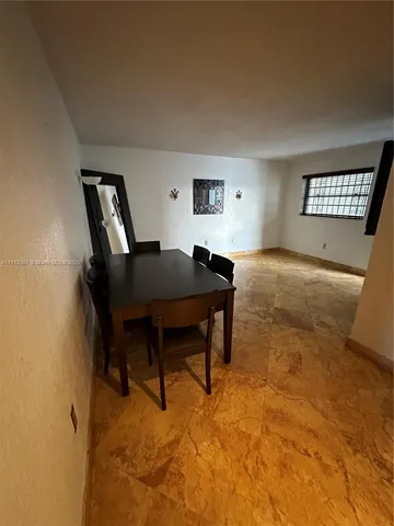 a workspace with furniture and window