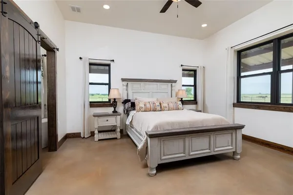 a bed sitting in a room next to a window