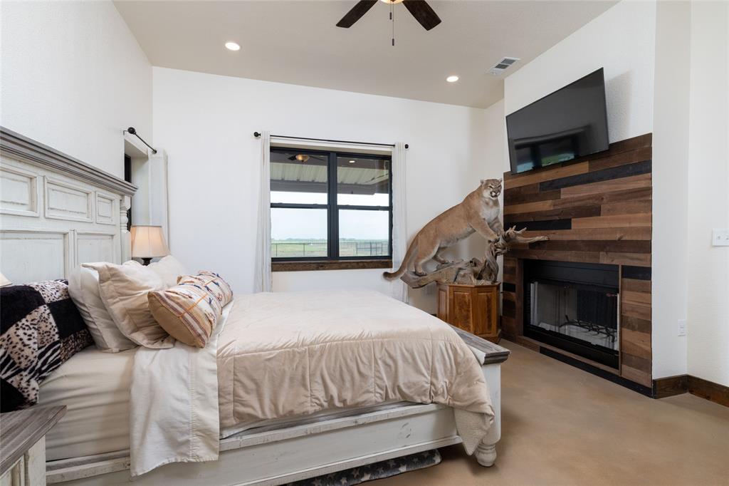 5543 Gray Road Nocona, TX 76255 - Photo 15 of 36 a bedroom with a bed and a television