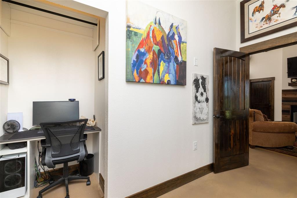 5543 Gray Road Nocona, TX 76255 - Photo 21 of 36 a view of a workspace with furniture and a window