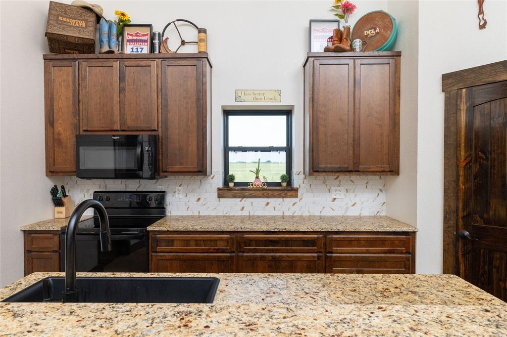 5543 Gray Road Nocona, TX 76255 - Photo 7 of 36 a bathroom with a bathtub and a window