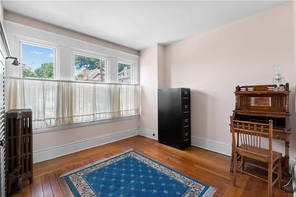a view of a livingroom with furniture and wooden floor