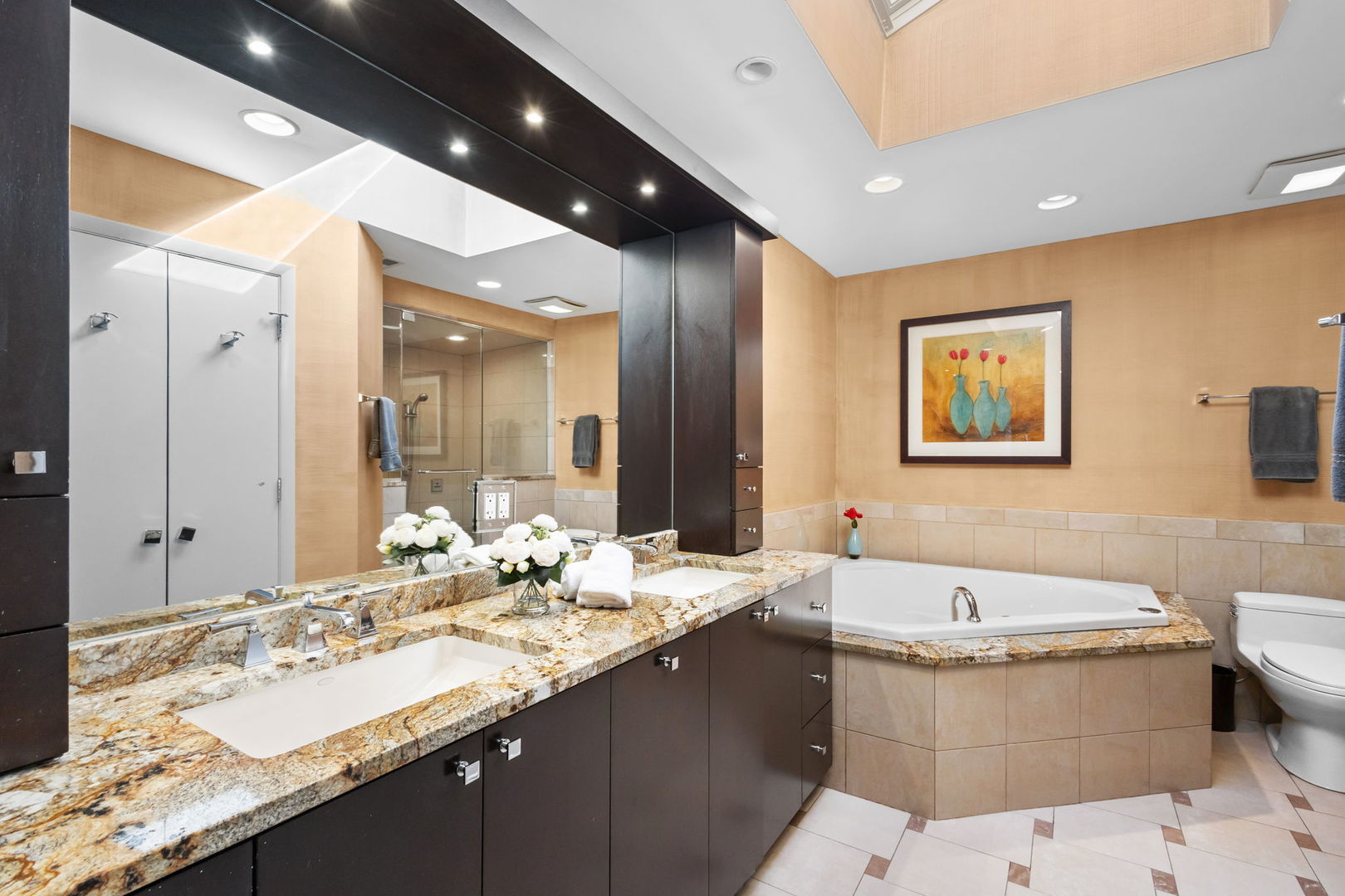 2775 Salceda Drive Northbrook, IL 60062 - Photo 16 of 37 a bathroom with a double vanity sink and a bathtub