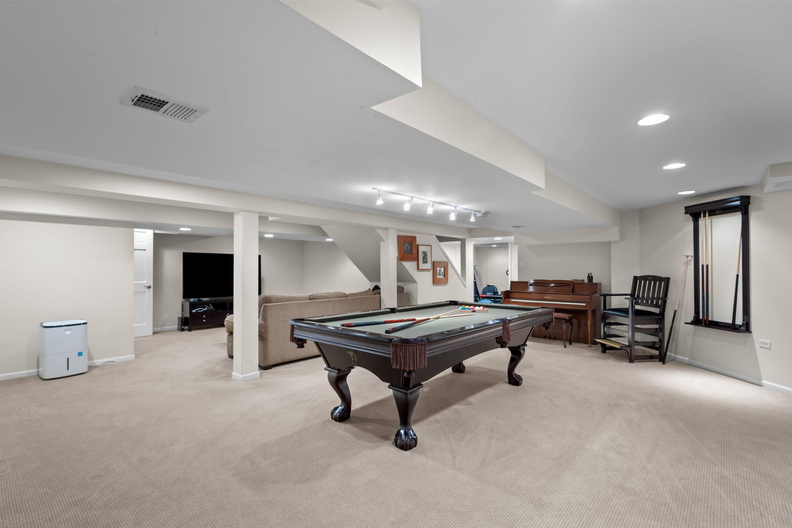 2775 Salceda Drive Northbrook, IL 60062 - Photo 25 of 37 a living room with furniture a table and chairs