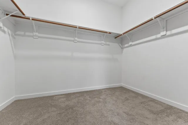 a view of an empty walk in closet