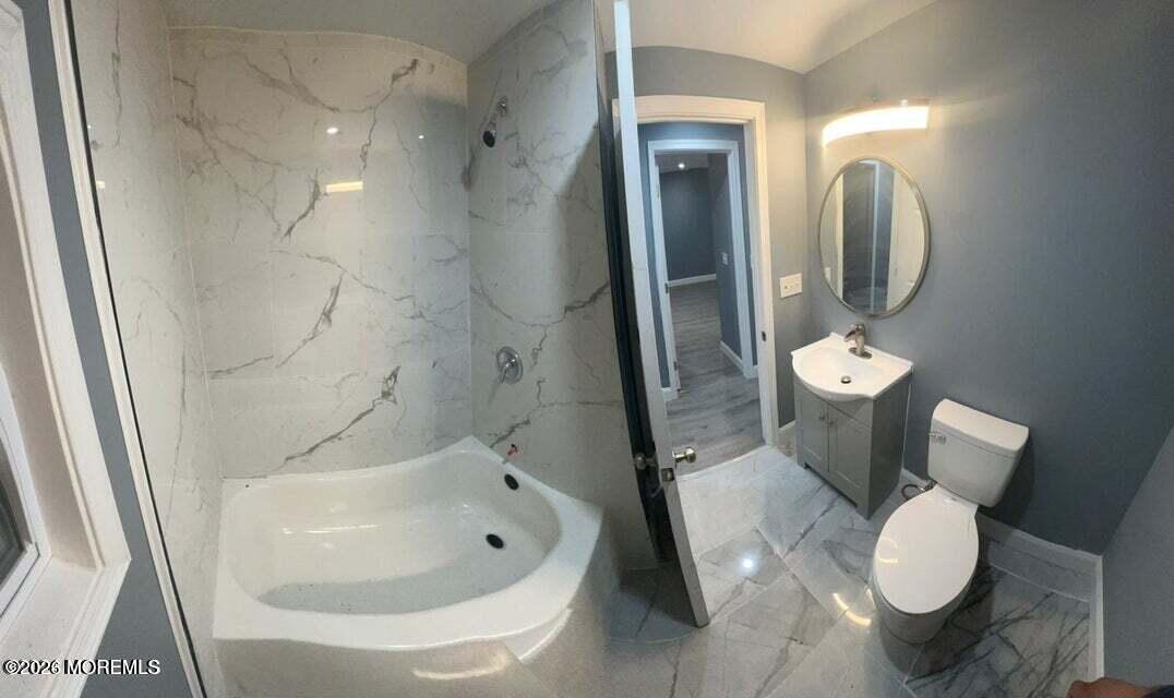 6611 Magnolia Drive Millville, NJ 08332 - Photo 11 of 14 a bathroom with a toilet sink and shower