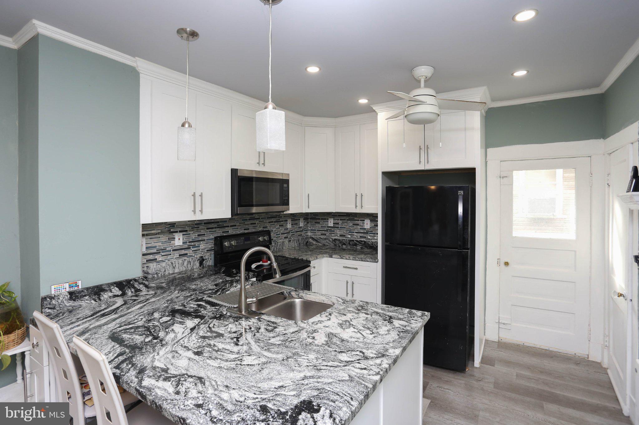 6901 Ridgeway Road Baltimore, MD 21222 - Photo 17 of 26 Modern kitchen with sleek finishes.
