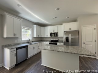 390 Summerhill Road Fayetteville, NC 28303 - Photo 5 of 27 a kitchen with stainless steel appliances granite countertop a sink a stove a refrigerator and cabinets