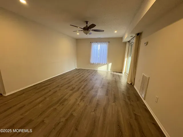 a kitchen with white cabinets stainless steel appliances and a sink