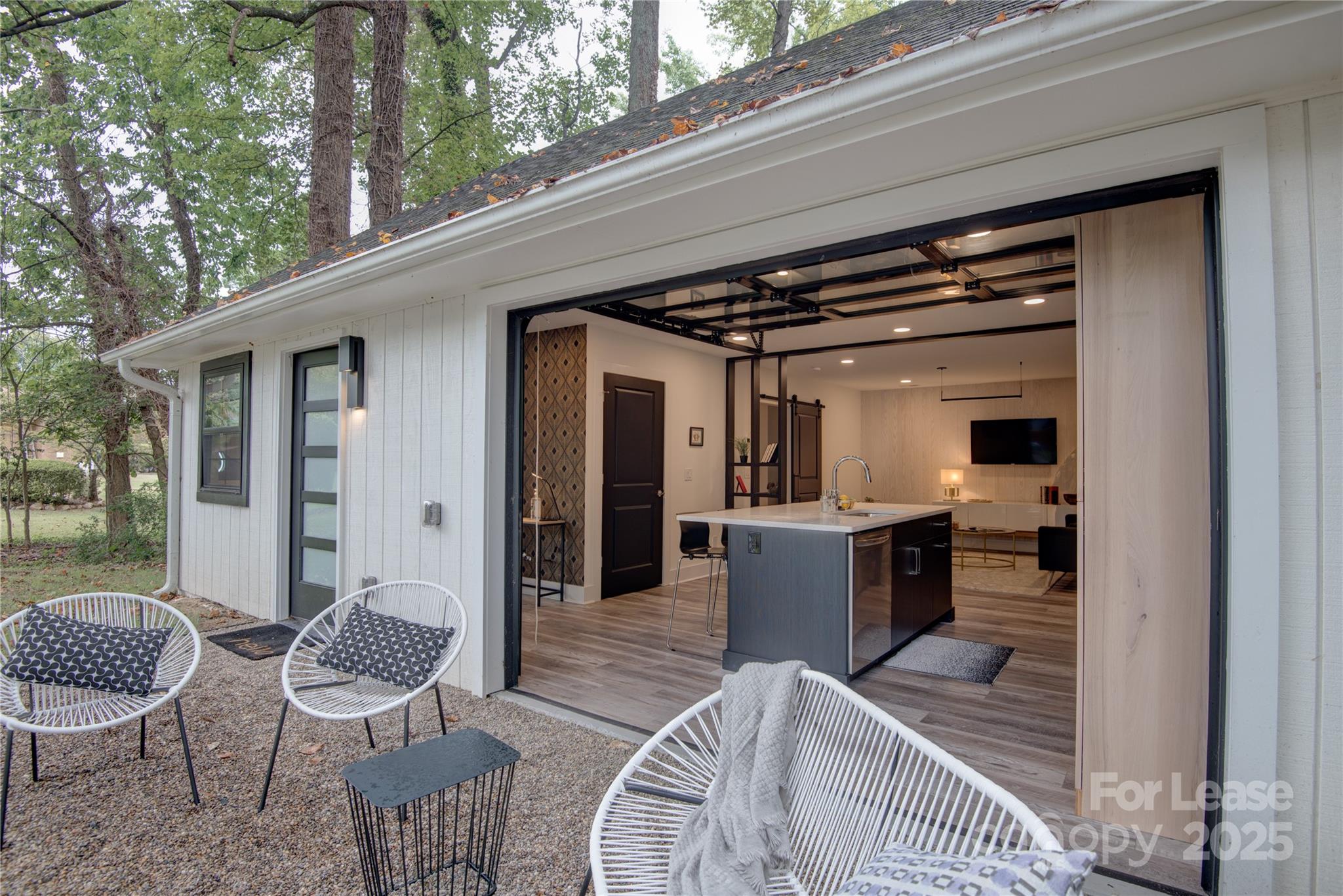 a view of living room kitchen and outdoor seating
