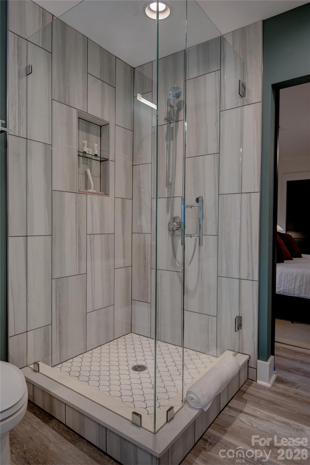 3945 Rockfern Road, Unit B Charlotte, NC 28217 - Photo 34 of 45 a bathroom with a bathtub and a shower