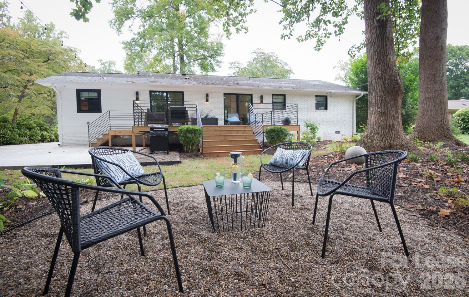 3945 Rockfern Road, Unit B Charlotte, NC 28217 - Photo 40 of 45 a view of a house with backyard and sitting area