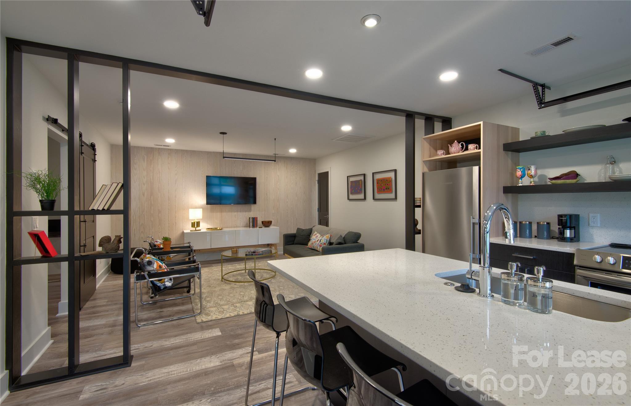 3945 Rockfern Road, Unit B Charlotte, NC 28217 - Photo 4 of 45 a large kitchen with a table and chairs