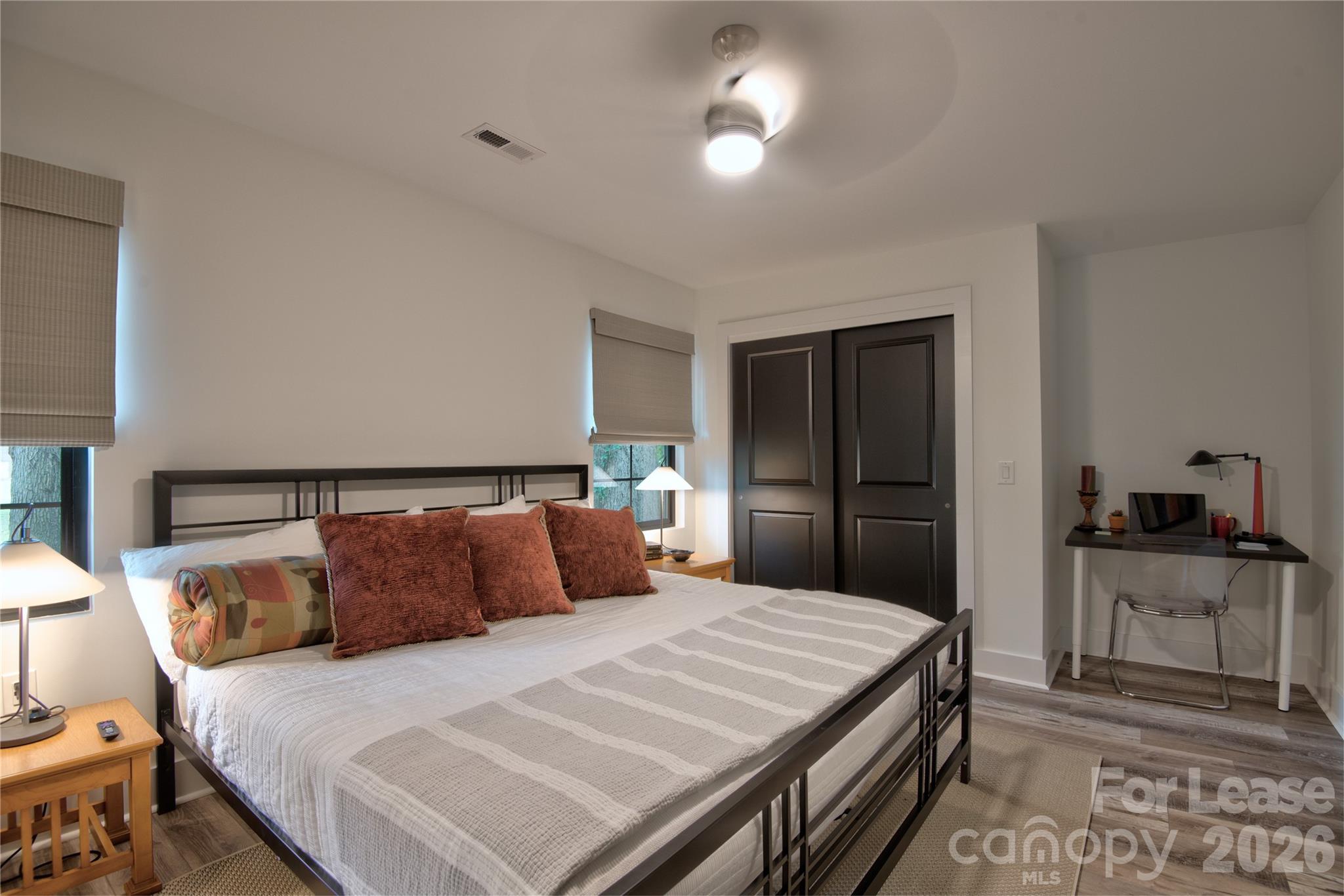3945 Rockfern Road, Unit B Charlotte, NC 28217 - Photo 5 of 45 a bedroom with a bed and a dresser