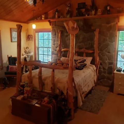 a bed sitting in a room next to a window