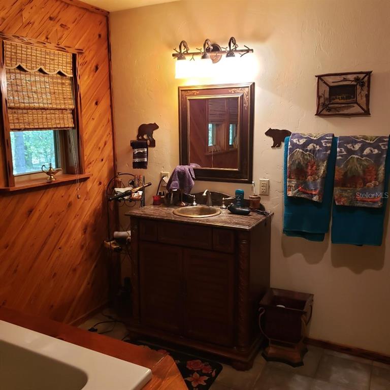 28063 31st Road Branford, FL 32008 - Photo 13 of 29 a bathroom with a sink and a mirror