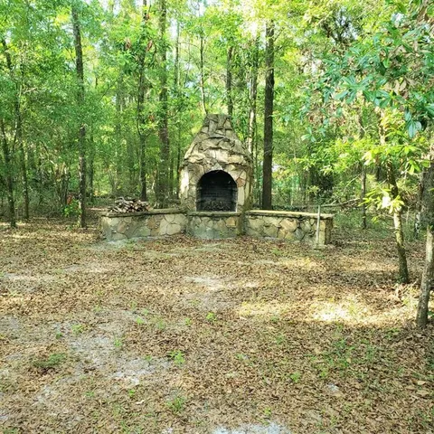 a view of a water fountain and a mountain view in the background