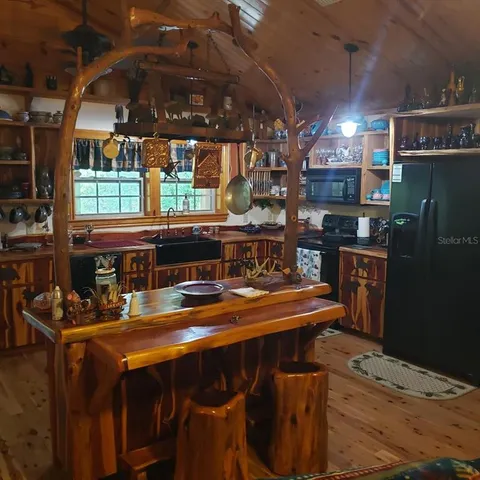 a dining room with a table and chairs