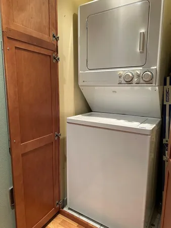 a stove top oven sitting inside of a kitchen