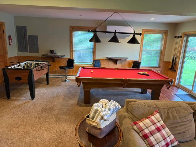 a bedroom with furniture and a fireplace