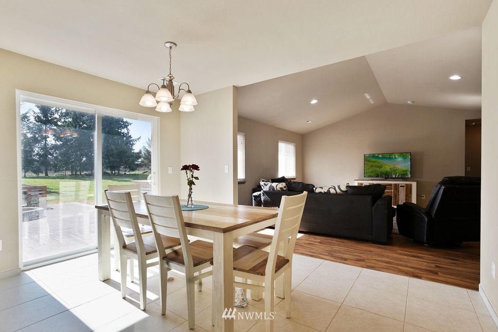 6307 192nd Lane Southwest Rochester, WA 98579 - Photo 14 of 25 a view of a dining room with furniture window and outside view