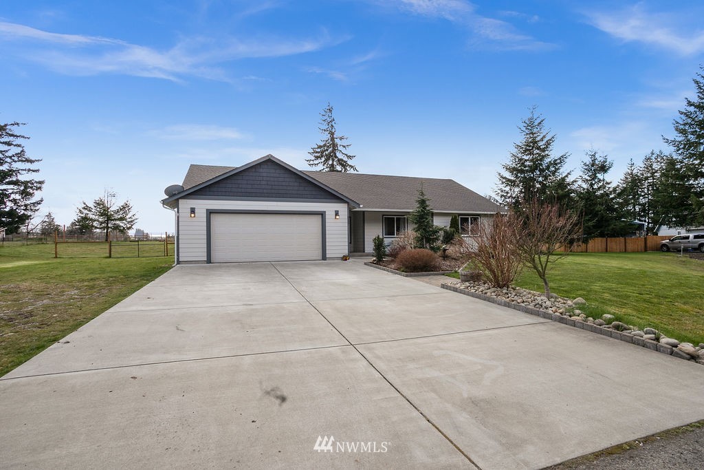 6307 192nd Lane Southwest Rochester, WA 98579 - Photo 23 of 25 a front view of a house with a yard
