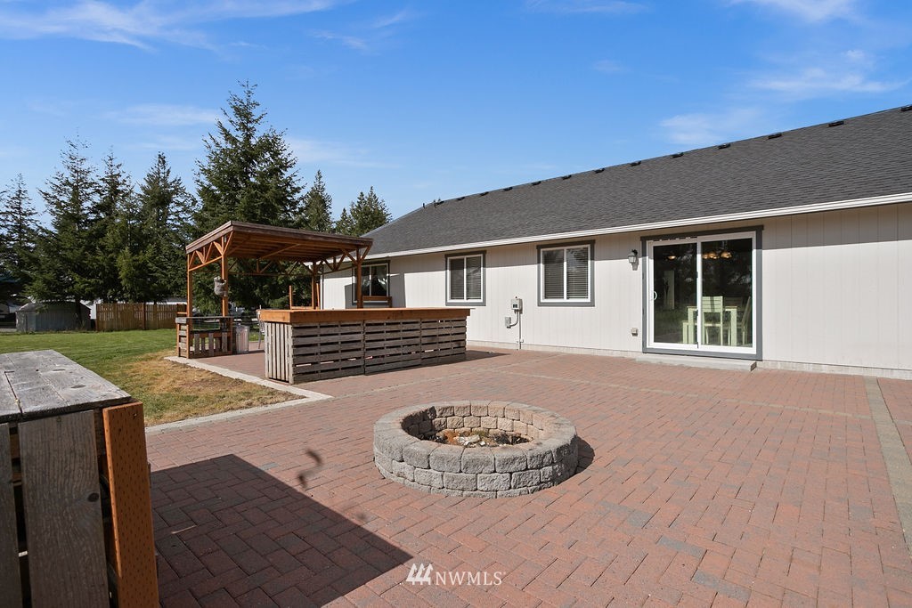 6307 192nd Lane Southwest Rochester, WA 98579 - Photo 4 of 25 a view of a house with backyard and sitting area