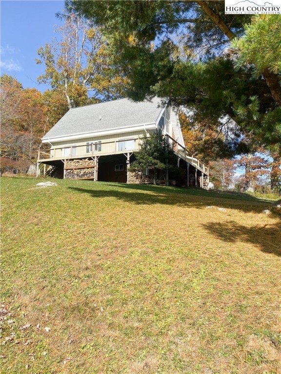 488 Hickory Mountain Road Sparta, NC 28675 - Photo 39 of 41 a view of a house with a yard and sitting area