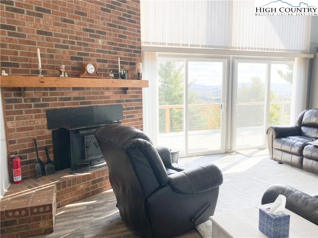 488 Hickory Mountain Road Sparta, NC 28675 - Photo 6 of 41 a living room with furniture and a fireplace