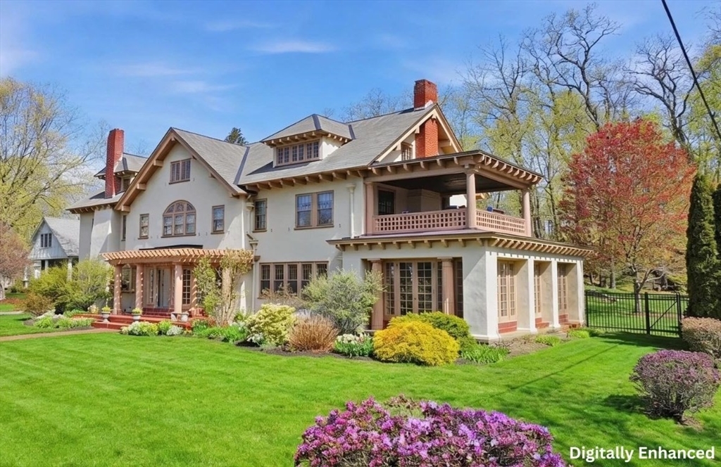 a front view of a house with garden