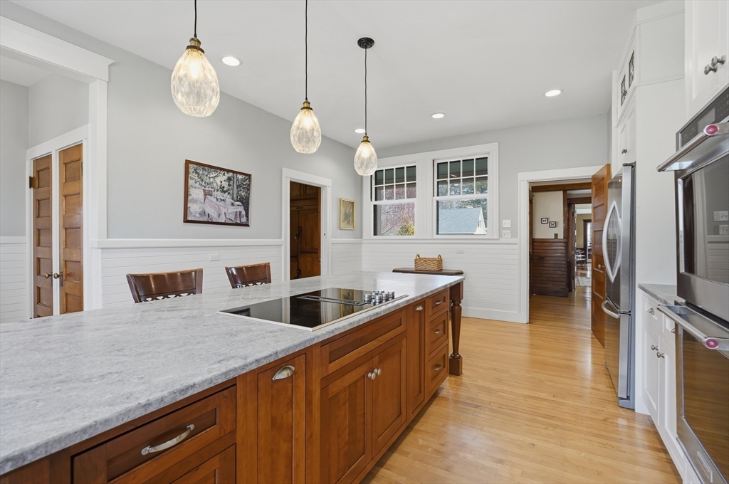 372 Main Street Amesbury, MA 01913 - Photo 14 of 42 a kitchen with stainless steel appliances granite countertop a sink a oven and a refrigerator