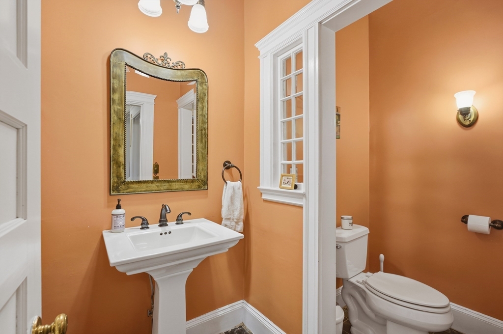 372 Main Street Amesbury, MA 01913 - Photo 19 of 42 a bathroom with a sink and mirror with toilet