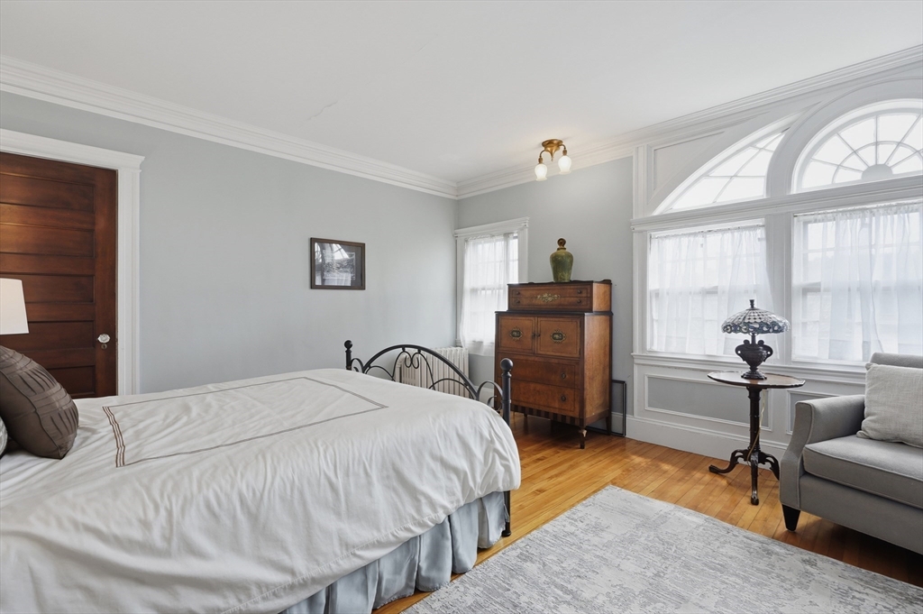372 Main Street Amesbury, MA 01913 - Photo 30 of 42 a bedroom with a bed and a couch
