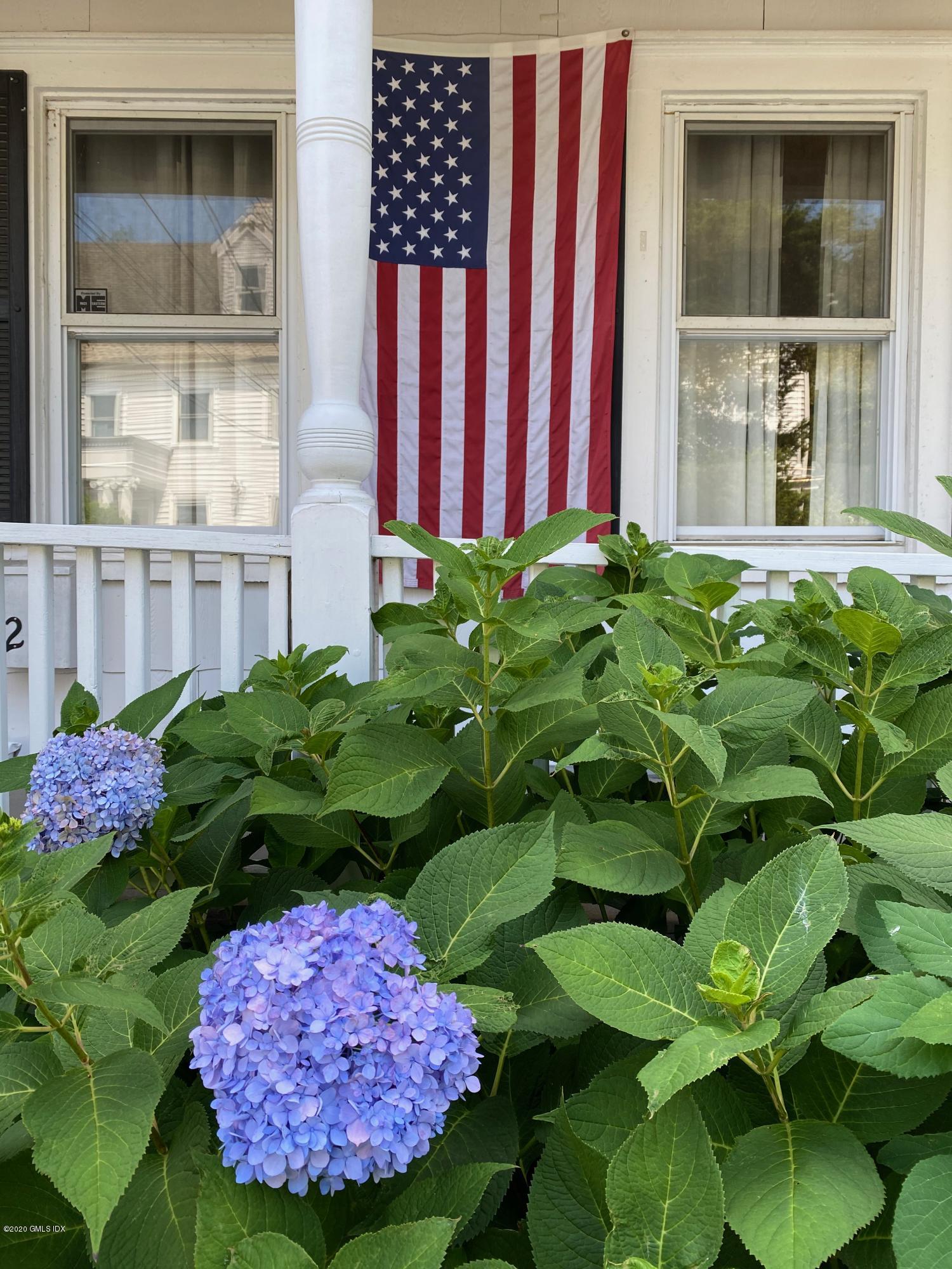 22 Division Street Greenwich, CT 06830 - Photo 26 of 28 a flower plants in front of a house