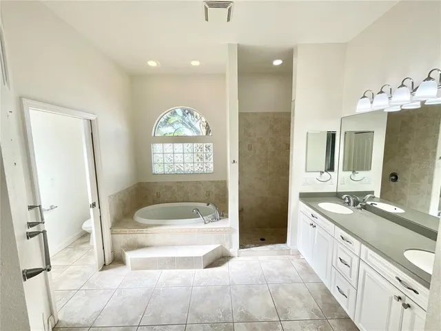 with white bath tub sitting in a bathroom