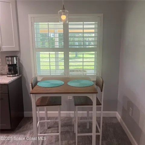 a room with a chair and a table