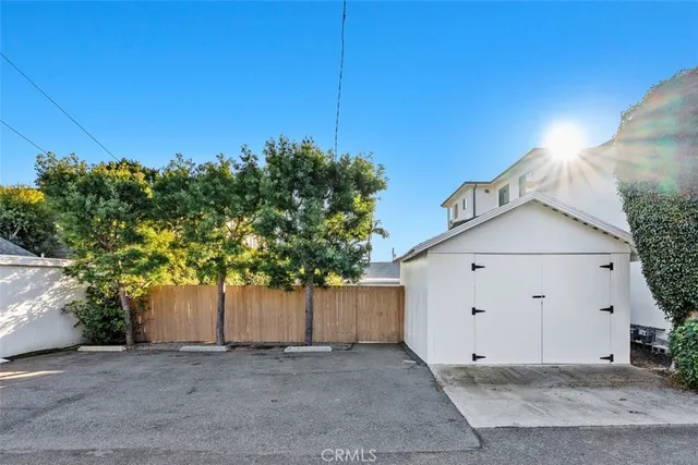a view of a house with a tree and a yard