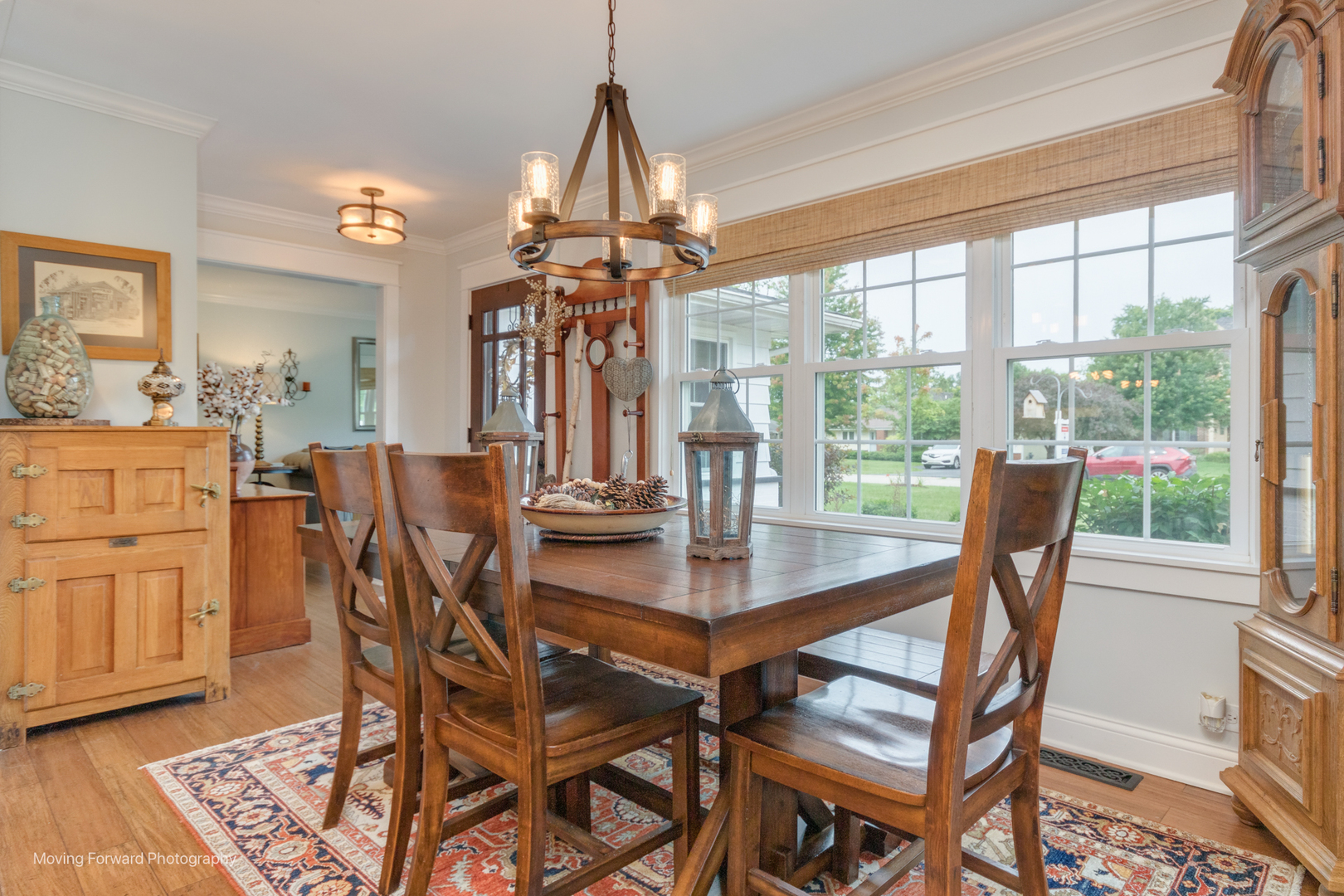 1845 Howard Street Wheaton, IL 60187 - Photo 14 of 41 a dining room with furniture a chandelier and wooden floor